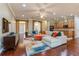 Spacious living room with hardwood floors, modern decor, and comfortable sectional sofa at 182 Crepe Myrtle Dr, Groveland, FL 34736