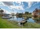 Lakeside backyard with dock, boat and lush green grass at 200 Maitland Ave # 131, Altamonte Springs, FL 32701