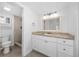 Bathroom with tiled shower, granite-look counters, and plenty of cabinet space at 200 Maitland Ave # 131, Altamonte Springs, FL 32701