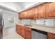 Modern kitchen with stainless steel appliances, granite countertops, and cherry wood cabinets at 200 Maitland Ave # 131, Altamonte Springs, FL 32701