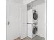 Laundry closet featuring a stacked washer and dryer at 200 Maitland Ave # 131, Altamonte Springs, FL 32701