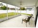 Screened in porch with chairs and a view of the fenced backyard at 2049 Crosscreek Ct, Oviedo, FL 32766