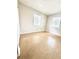 A well-lit bedroom featuring two windows and neutral walls at 2426 Barbarossa Ave, Deltona, FL 32738