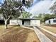 Charming single-story home featuring neutral paint, black door and a driveway at 2426 Barbarossa Ave, Deltona, FL 32738