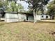 View of home's front yard, house number, and side detached structure at 2426 Barbarossa Ave, Deltona, FL 32738