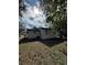Low angle view of the rear of the house showing the yard at 2426 Barbarossa Ave, Deltona, FL 32738