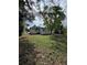 Low angle view of the rear of the house showing the yard at 2426 Barbarossa Ave, Deltona, FL 32738
