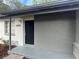 Close up on the front door with grey-painted brick facade at 2426 Barbarossa Ave, Deltona, FL 32738