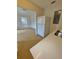 Open view of the kitchen sink, refrigerator and connection to the living room at 2426 Barbarossa Ave, Deltona, FL 32738