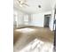 View of spacious empty living room with laminate floors and overhead fan at 2426 Barbarossa Ave, Deltona, FL 32738