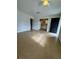 Open living room leading to the kitchen with black front door at 2426 Barbarossa Ave, Deltona, FL 32738