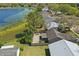 Aerial view showing the deck, backyard and houses in a neighborhood near a lake at 2439 Lake Jackson Cir, Apopka, FL 32703