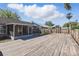This home has a spacious backyard with a large wooden deck for outdoor entertaining at 2439 Lake Jackson Cir, Apopka, FL 32703