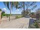 The large, private backyard has a deck and views of the lake at 2439 Lake Jackson Cir, Apopka, FL 32703