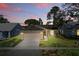 Charming single-story home with a well-maintained front yard and a two-car garage at 2439 Lake Jackson Cir, Apopka, FL 32703