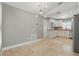 Inviting kitchen with white cabinets, stainless steel appliances and an adjacent breakfast nook at 2439 Lake Jackson Cir, Apopka, FL 32703