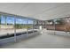 The enclosed sunroom overlooks the spacious backyard and adjacent lake at 2439 Lake Jackson Cir, Apopka, FL 32703
