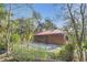 Home with front concrete patio area and landscaping at 255 Butterfly Forest Rd, Geneva, FL 32732