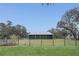 Beautiful blue home with a metal roof and screened porch set on expansive lot at 255 Butterfly Forest Rd, Geneva, FL 32732