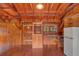 The kitchen features rustic wood finishes, a sink, a microwave and a refrigerator at 255 Butterfly Forest Rd, Geneva, FL 32732