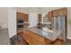 Spacious kitchen features stainless steel appliances, granite countertops, and modern fixtures at 255 Butterfly Forest Rd, Geneva, FL 32732