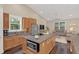 Open-concept kitchen and living area with stainless steel appliances and granite countertops at 255 Butterfly Forest Rd, Geneva, FL 32732