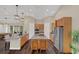 Modern kitchen featuring stainless steel appliances, granite countertops and wooden island with barstools at 255 Butterfly Forest Rd, Geneva, FL 32732