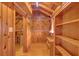Open living area boasts beautiful wood finishes, built-in shelving, and a closet at 255 Butterfly Forest Rd, Geneva, FL 32732