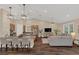 Open-concept living area with breakfast bar, kitchen, and comfortable seating at 255 Butterfly Forest Rd, Geneva, FL 32732