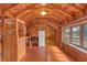 Spacious living room features beautiful wood finishes, natural light, and an open layout at 255 Butterfly Forest Rd, Geneva, FL 32732