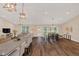 Open-concept living area with granite counter, dining, and cozy seating at 255 Butterfly Forest Rd, Geneva, FL 32732