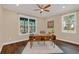 Bright office featuring a unique wood desk, stylish decor, wood floors, and natural light at 255 Butterfly Forest Rd, Geneva, FL 32732