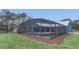 A screened pool enclosure provides the ultimate relaxation and privacy at 255 Butterfly Forest Rd, Geneva, FL 32732