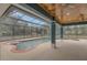Screened-in pool area with a unique design, seating area, and ample space for recreation at 255 Butterfly Forest Rd, Geneva, FL 32732