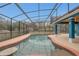 Large, screened pool area with a beautiful pool and ample outdoor space at 255 Butterfly Forest Rd, Geneva, FL 32732