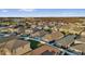 Neighborhood aerial view featuring closely spaced homes, backyards, and a distant lake at 2890 Avian Loop, Kissimmee, FL 34741