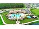Community aerial view featuring a large pool and clubhouse, and other neighborhood amenities by the lake at 2890 Avian Loop, Kissimmee, FL 34741