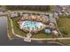 Expansive community pool area features a main pool, a kiddie pool, and a large clubhouse with ample parking at 2890 Avian Loop, Kissimmee, FL 34741