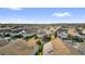 An aerial view showcases a neighborhood with well-maintained homes and green spaces at 2890 Avian Loop, Kissimmee, FL 34741