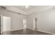 Bright and airy bedroom with neutral walls, wood flooring, and walk-in closet access at 2890 Avian Loop, Kissimmee, FL 34741
