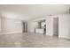 Bright and airy living area with neutral walls, tiled floors, and open layout connecting to the kitchen at 2890 Avian Loop, Kissimmee, FL 34741