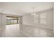 Spacious living room with access to the backyard and plenty of natural light from the large windows at 2890 Avian Loop, Kissimmee, FL 34741
