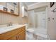 Neutral bathroom with vanity, mirror, and shower/tub combination with neutral walls at 290 Orange Ave, St Cloud, FL 34769