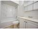 Clean white bathroom with a shower-tub combo, toilet, and vanity with sink at 290 Orange Ave, St Cloud, FL 34769