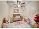 bedroom with tile floors, a crib, and colorful assortment of toys at 290 Orange Ave, St Cloud, FL 34769