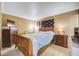 Relaxing bedroom with tiled floors, warm lighting, and a comfortable bed setup at 290 Orange Ave, St Cloud, FL 34769