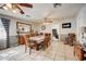 Expansive dining area with tile flooring, ceiling fans, and plenty of natural light for enjoyable meals at 290 Orange Ave, St Cloud, FL 34769