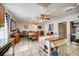 Spacious kitchen and dining area with tile floors, ceiling fans, ample cabinetry, and stainless steel appliances at 290 Orange Ave, St Cloud, FL 34769