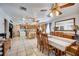 A spacious kitchen with a breakfast bar, dining area, and tile flooring perfect for Gathering gatherings at 290 Orange Ave, St Cloud, FL 34769