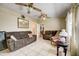 A well-lit living room featuring tile flooring, neutral paint and ceiling fans at 290 Orange Ave, St Cloud, FL 34769